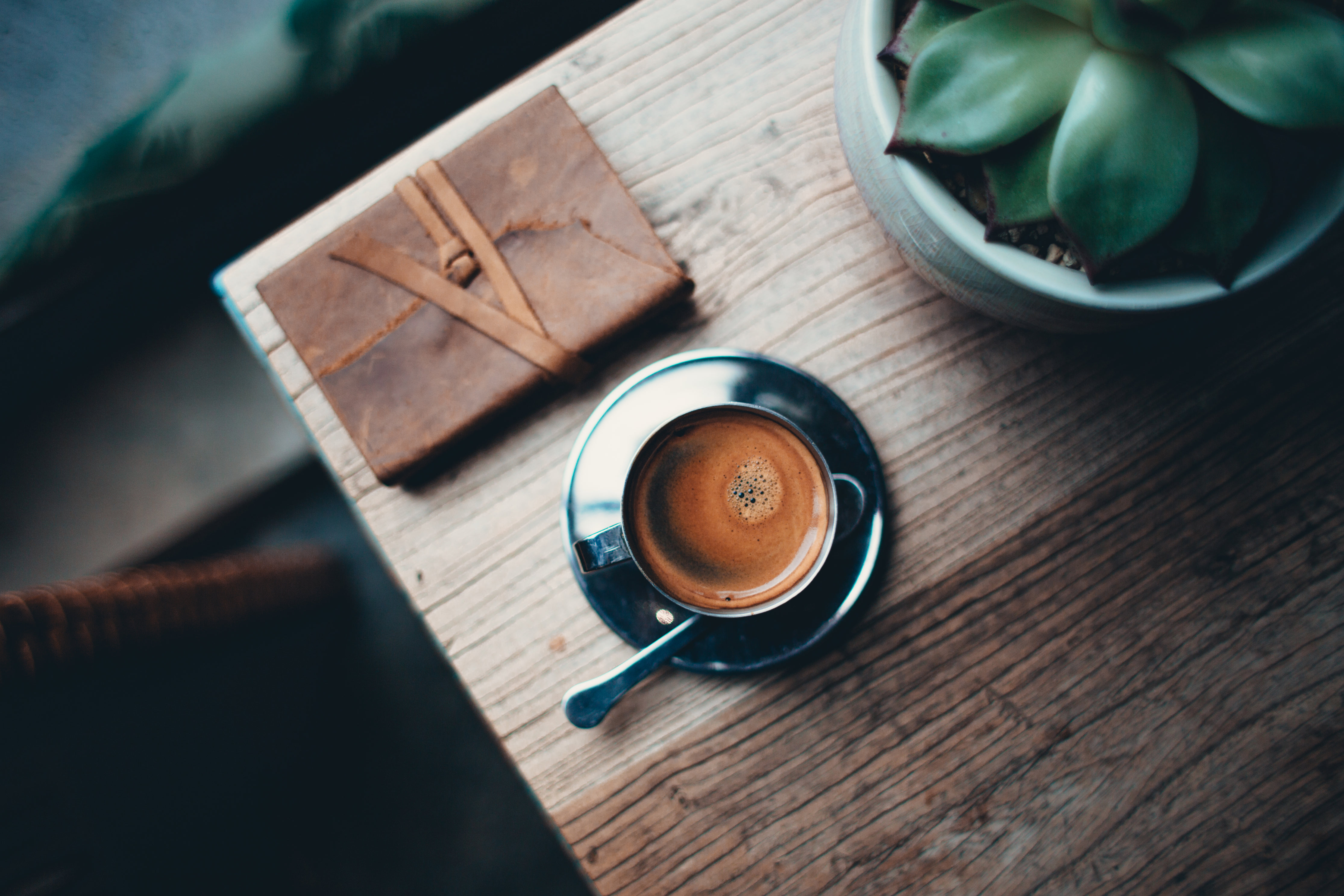Coffee with journal on table